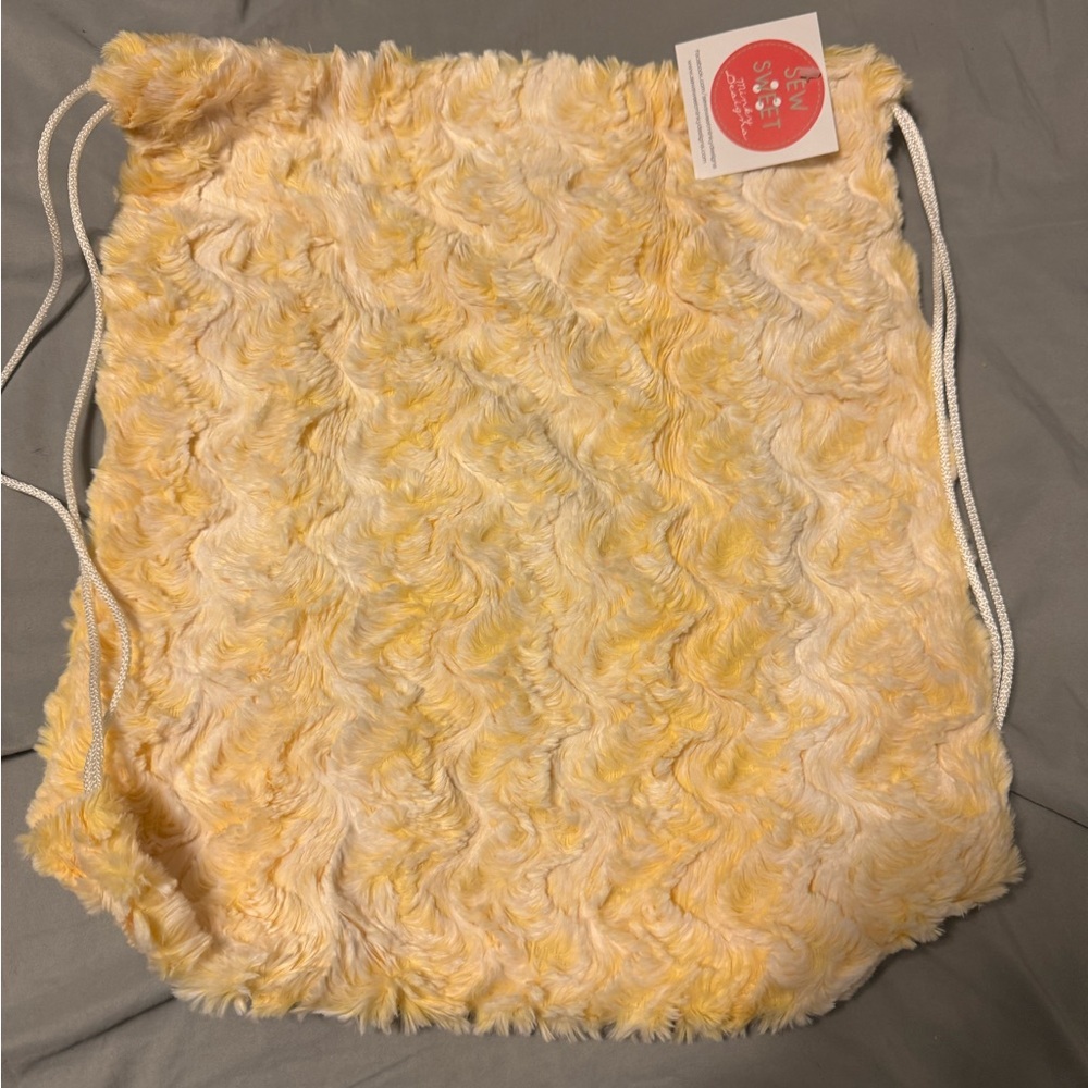 Yellow and White Backpack with Stylish Design